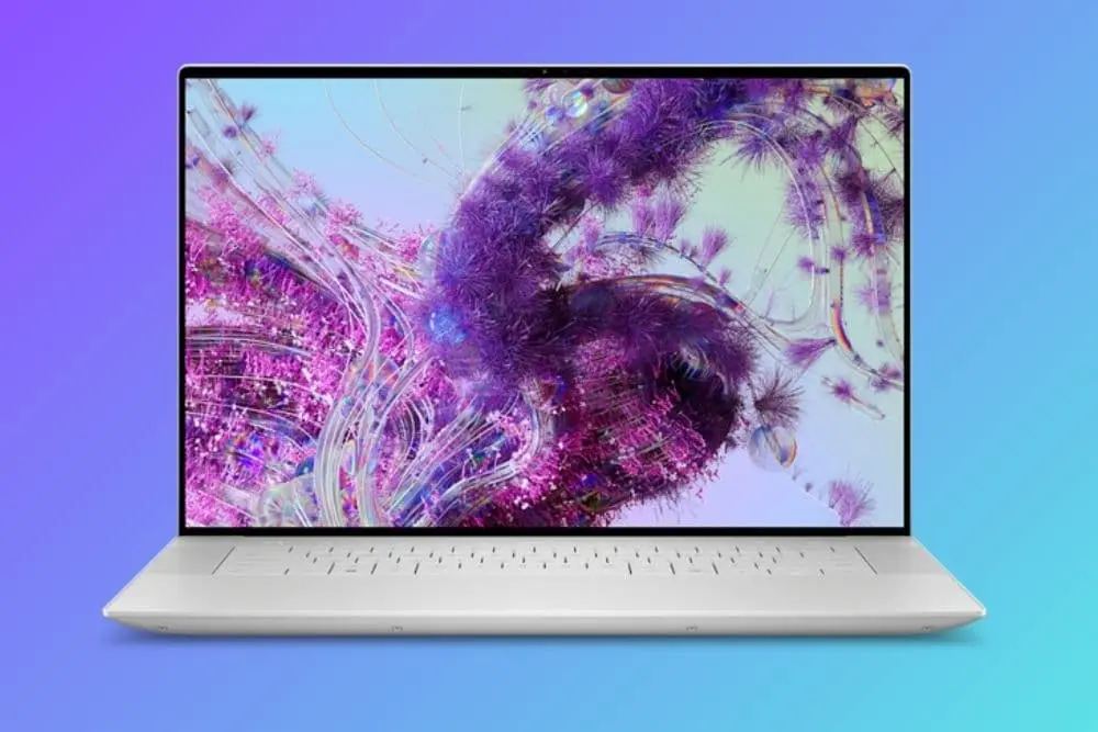 Notebook Dell XPS 16 em um fundo degrade.