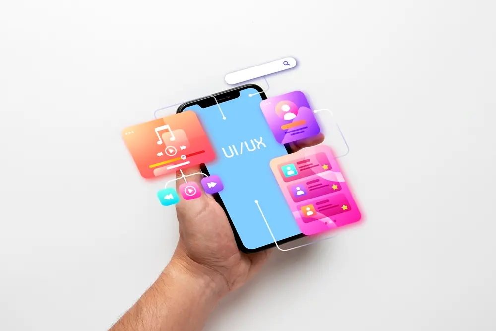 Uma mão segura um smartphone exibindo "UI/UX", cercado por ícones vibrantes de aplicativos para música e perfis de usuários.